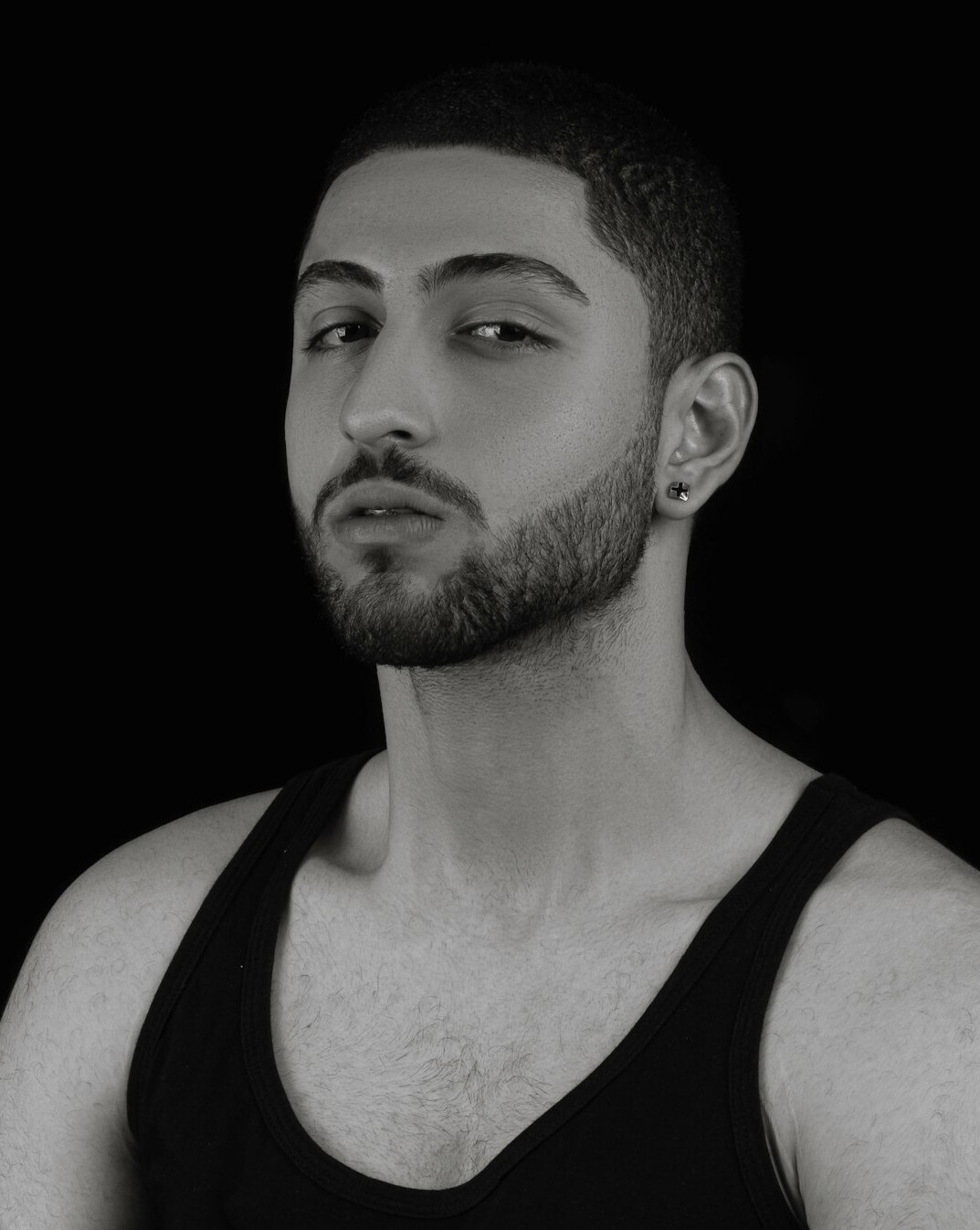 Studio portrait of a young man with short beard