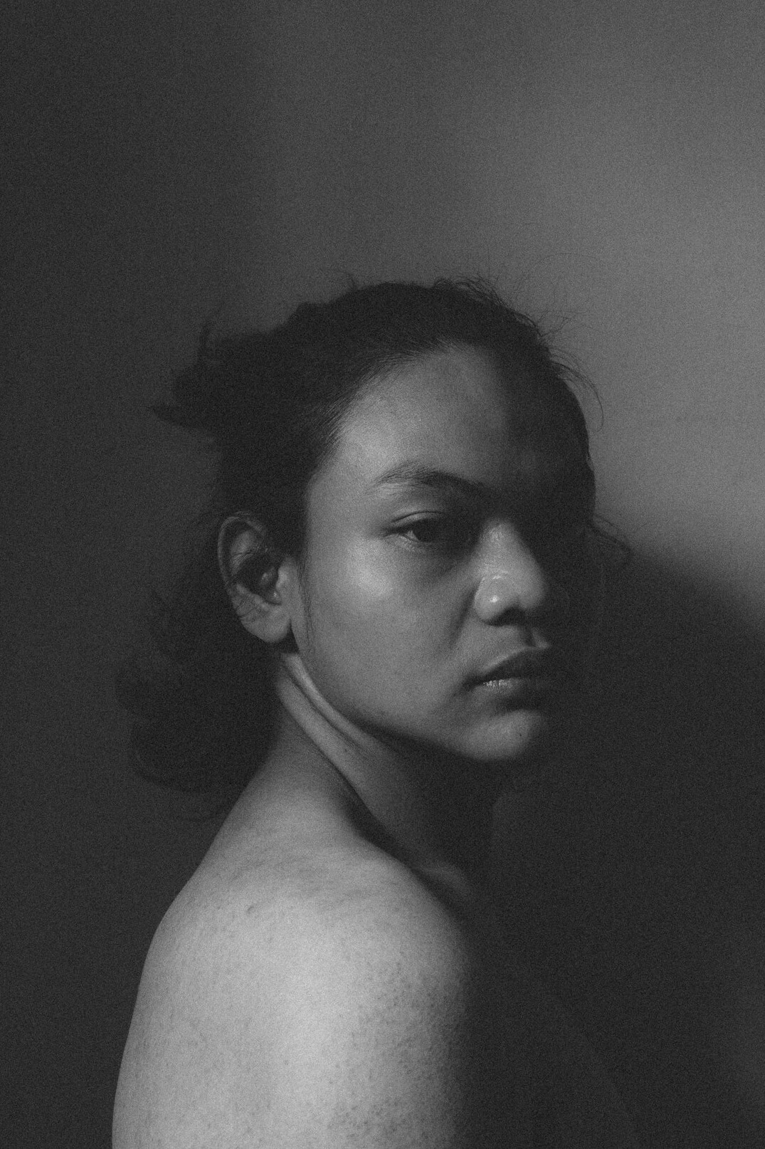 Studio portrait of a woman with short dark hair